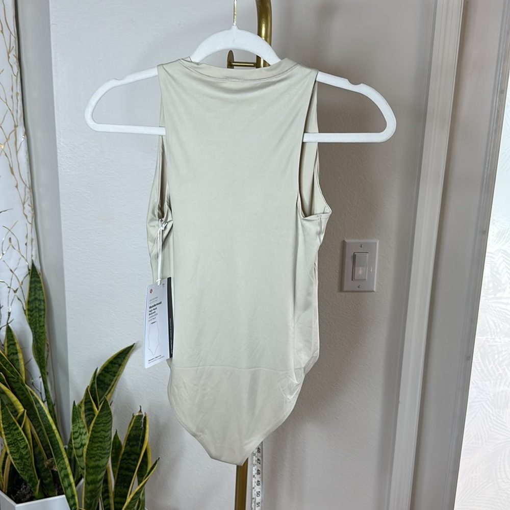187. NWT Lululemon Wundermost Ultra-Soft Nulu High-Neck Bodysuit
Mojave Tan - Picture 8 of 10